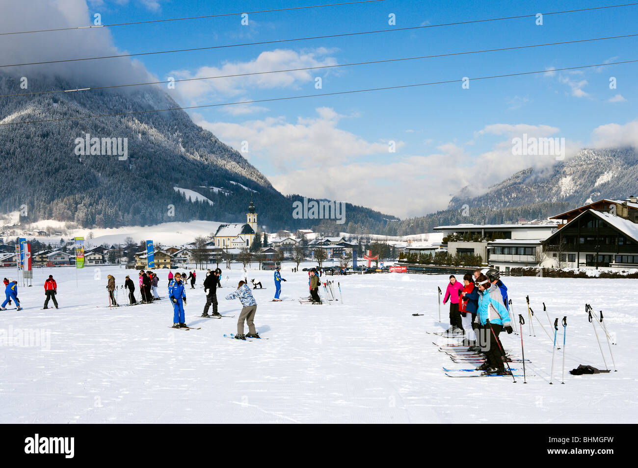 Ski school on the nursery slopes just outside the resort of Soll, SkiWelt ski region, Tyrol, Austria Stock Photo