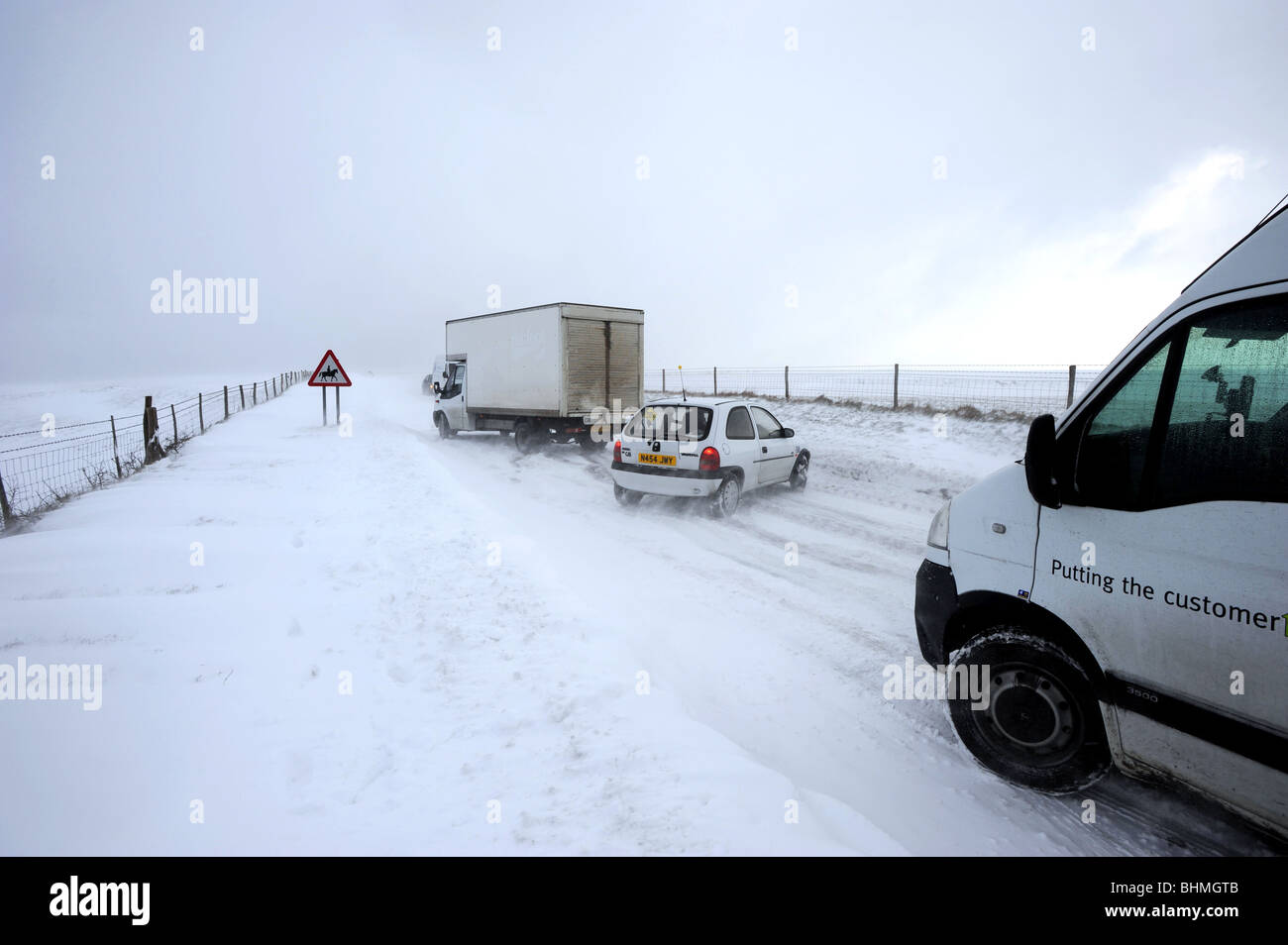 Cars and lorries stuck road on the top of a hill at East Dean in Sussex after blizzard like conditions hit the country again Stock Photo