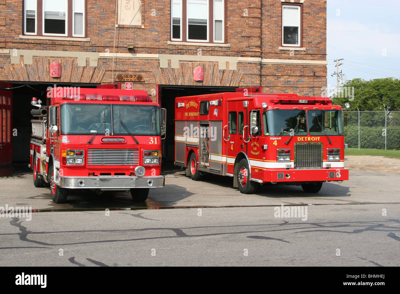 Engine Co # 31 and Squad Co # 4 parked in front of firehouse Detroit MI  USA, by Dembinsky Photo Assoc Stock Photo