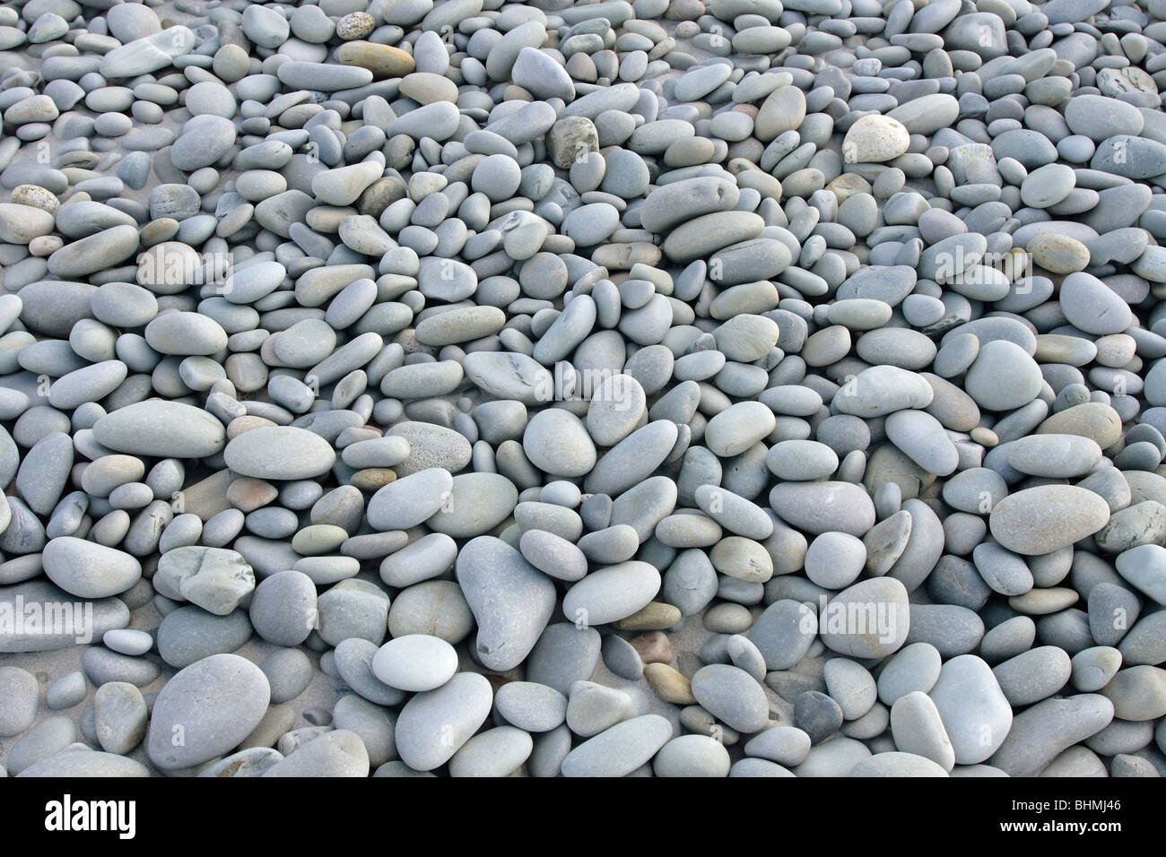 smooth beach stones on a beach Stock Photo Alamy