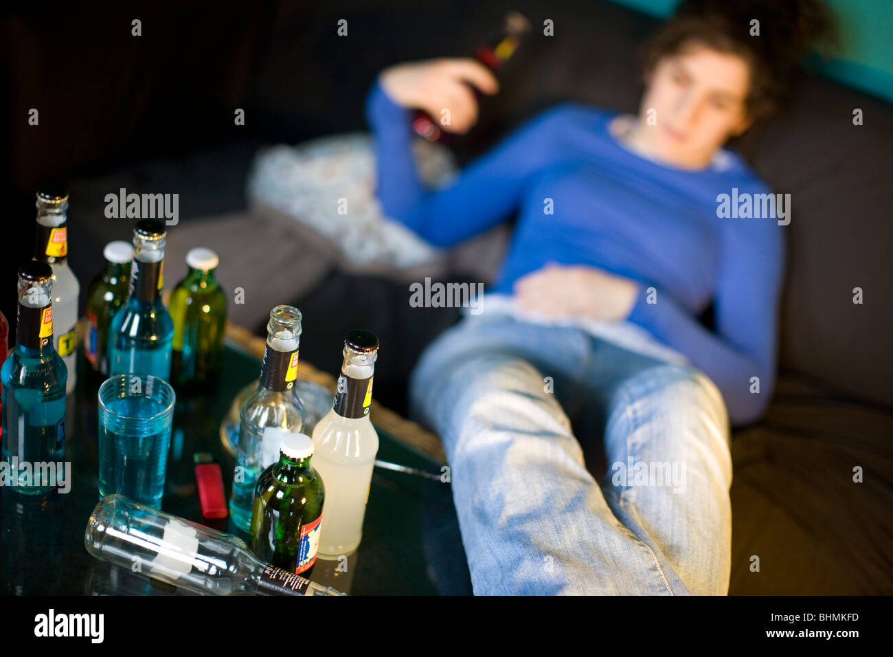 Young woman and alcopop drinks, London MODEL RELEASED Stock Photo