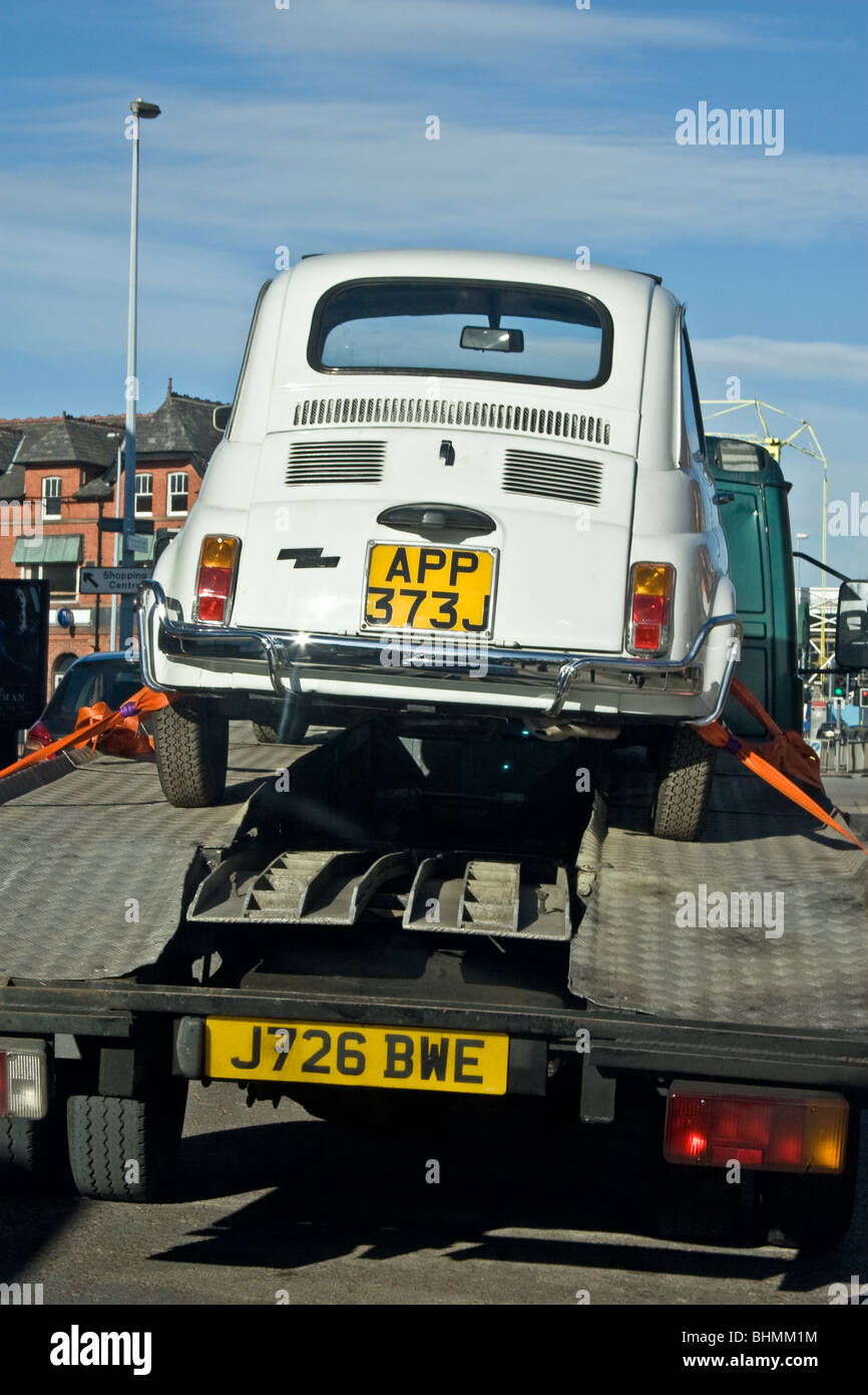 Fiat Cinquecento (500) on trailer, UK Stock Photo