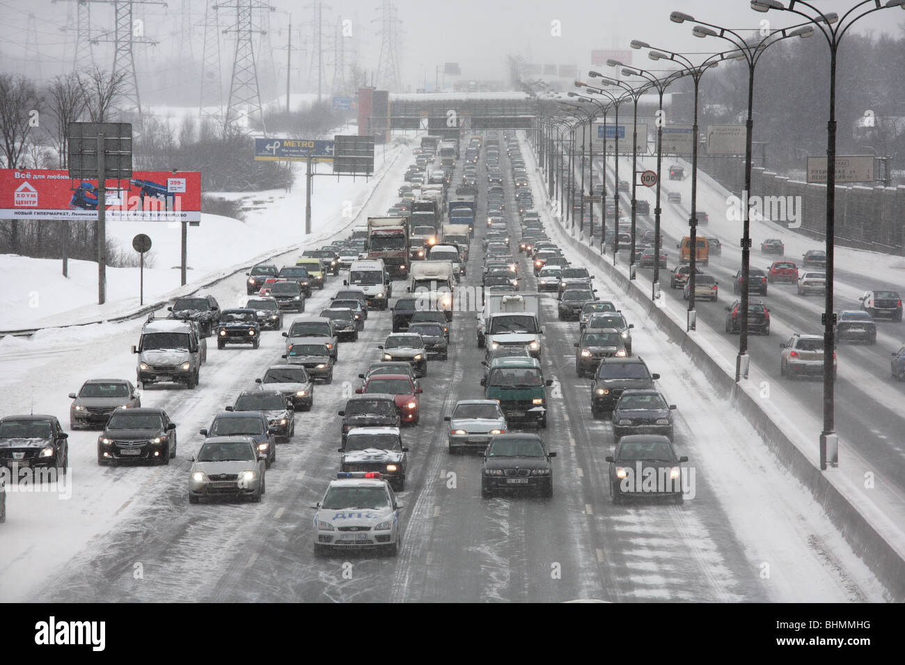 A snowstorm slows traffic on MKAD, Moscow, Russia. Stock Photo