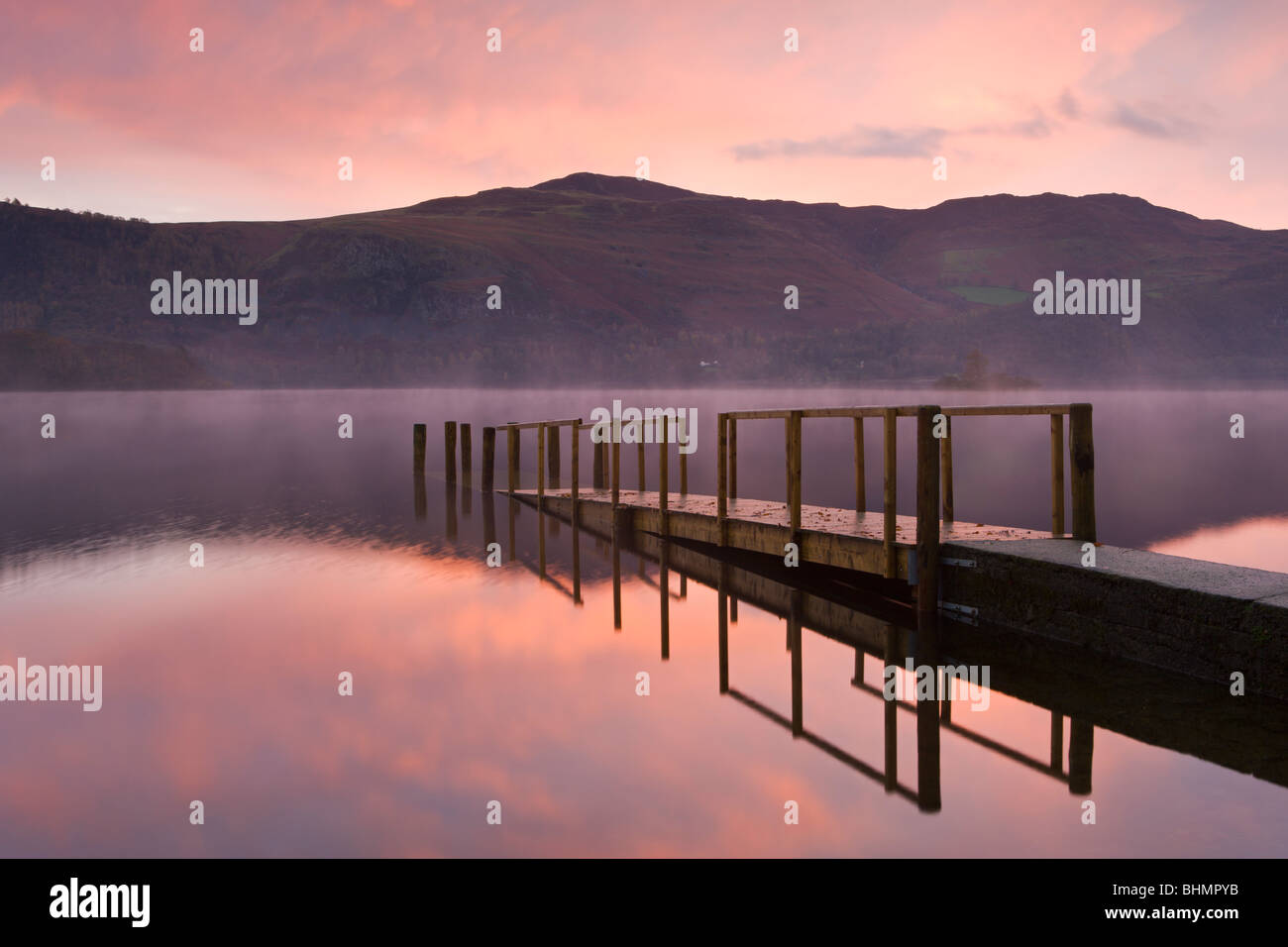 Sunrise over Derwent Water from Hawes End jetty, Lake District National Park, Cumbria, England, UK. Autumn (November) 2009 Stock Photo