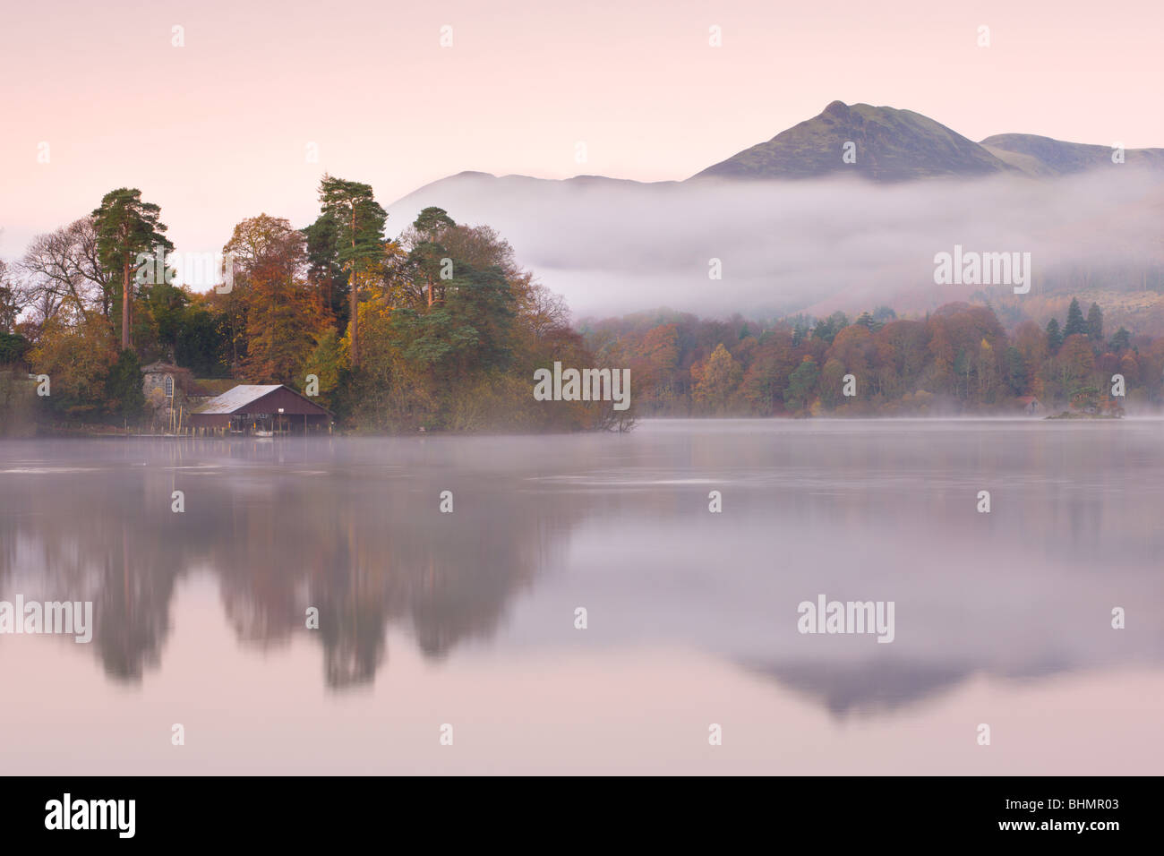 Boathouse on a misty Derwent Water, Lake District National Park, Cumbria, England. Autumn