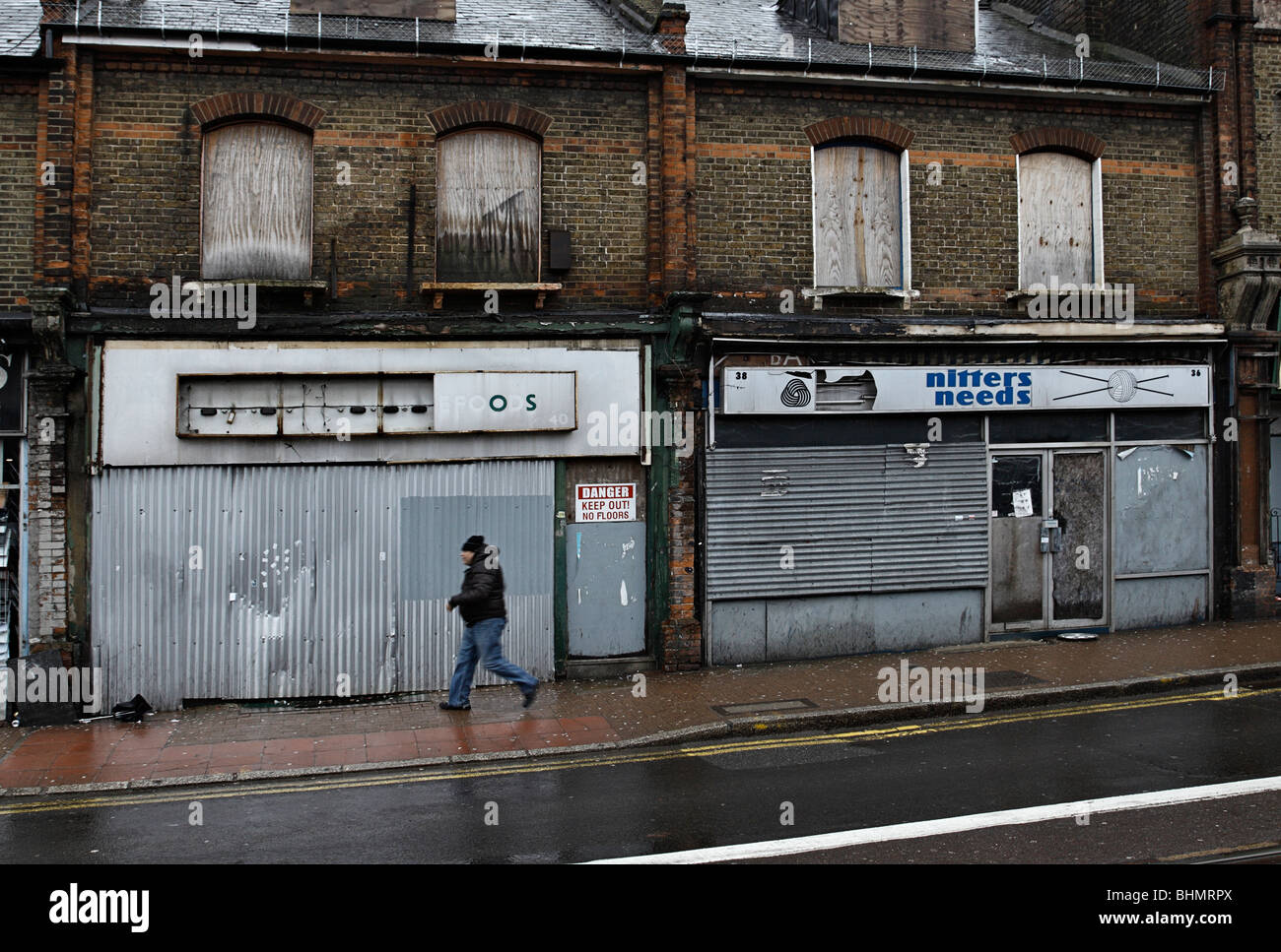 Row of dilapidated shops Station Road, Croydon. Stock Photo