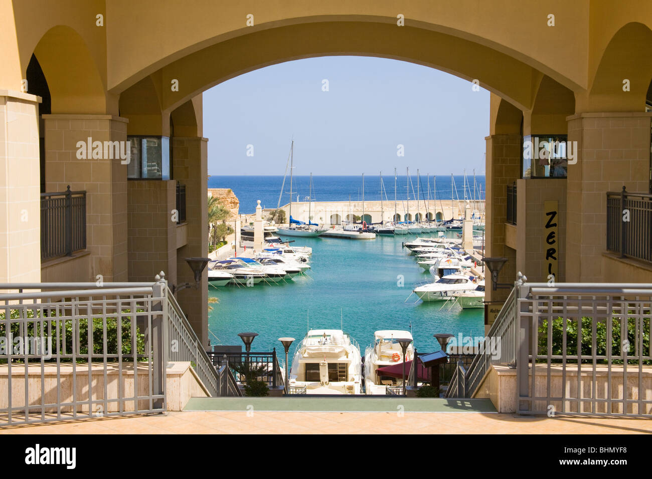 View through arch to Portomaso Marina at Saint Julian’s on the island of Malta Stock Photo