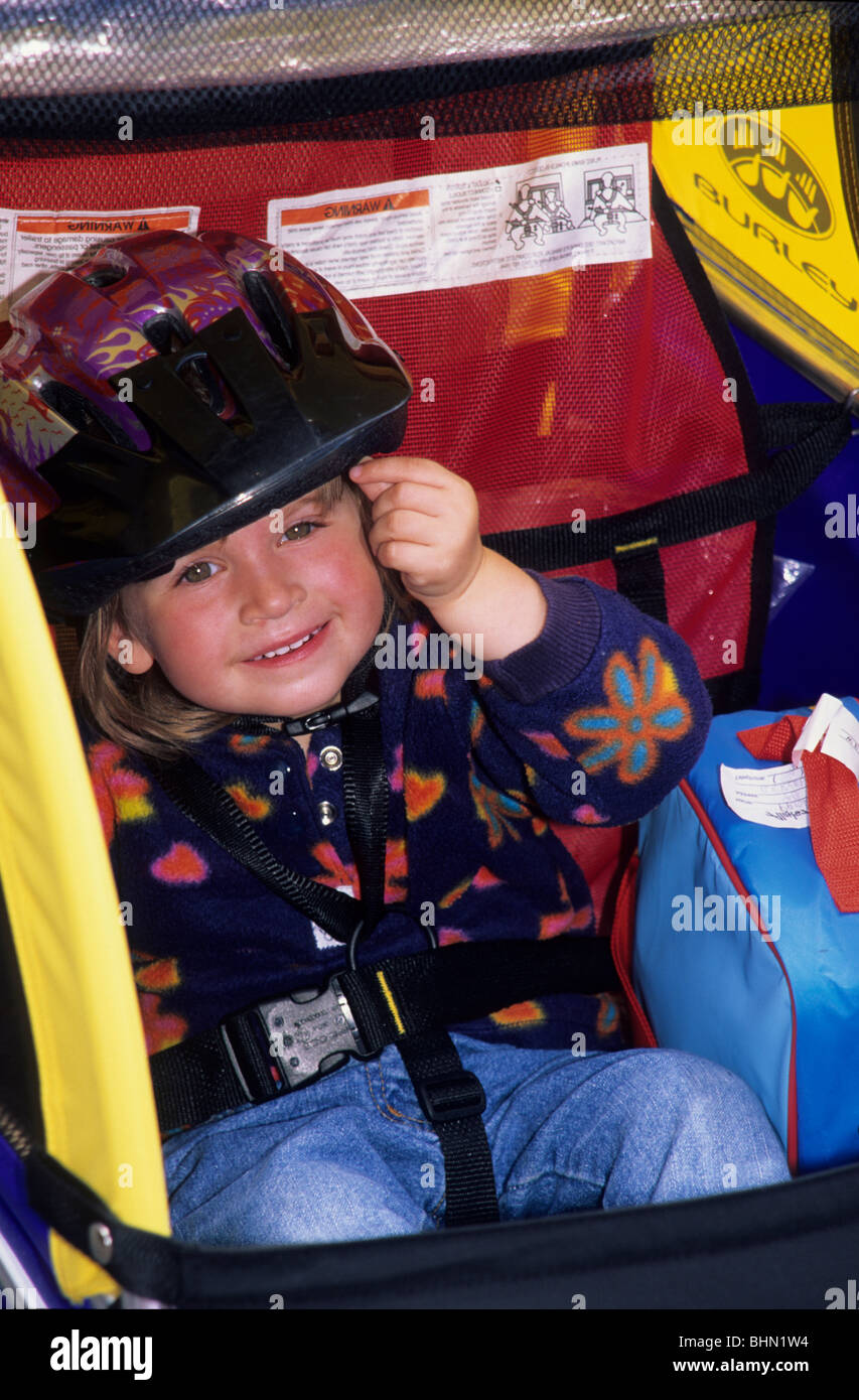 Child in bike trailer Stock Photo Alamy