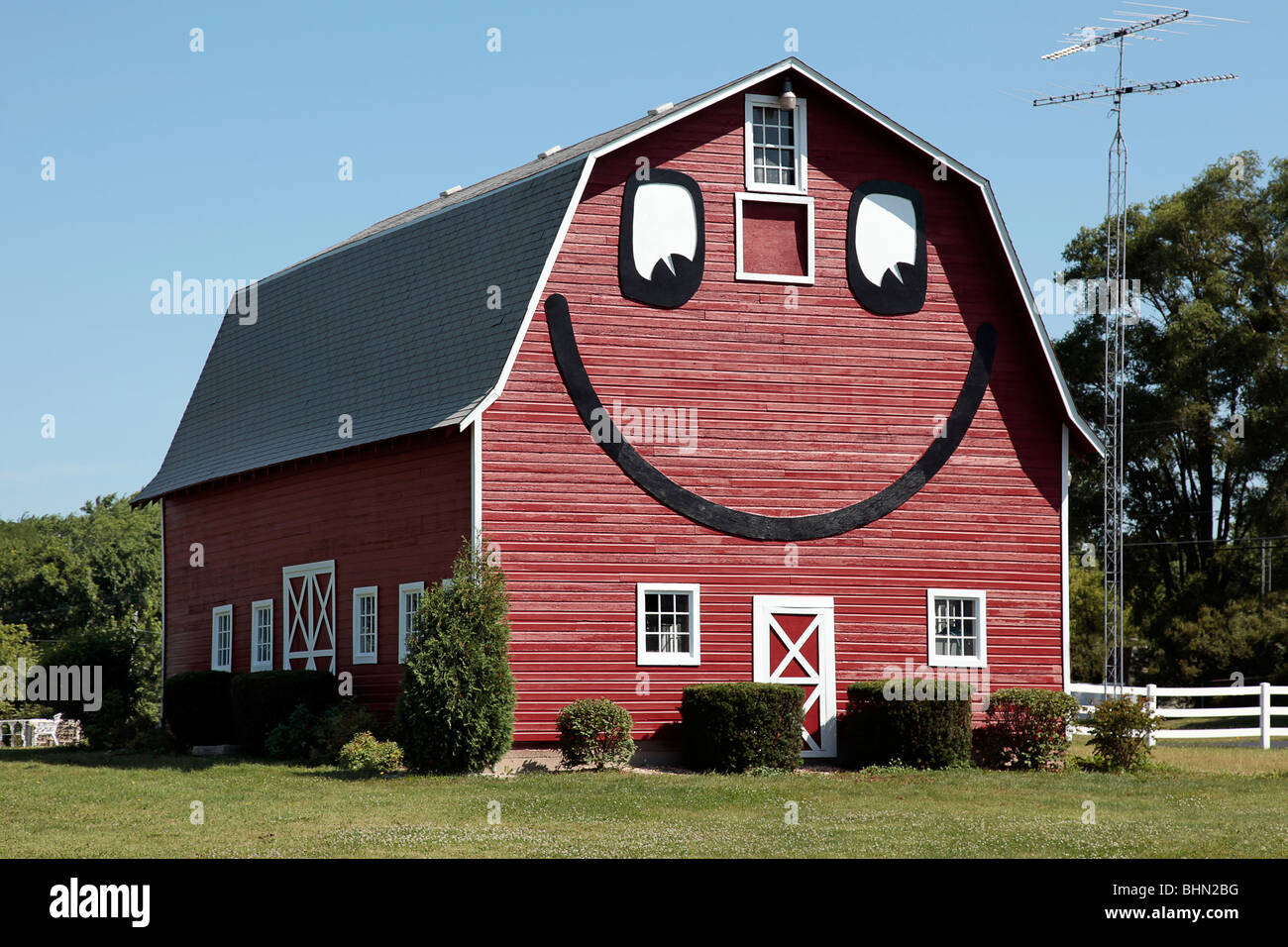 Smiley face barn beside rural home in Southern Wisconsin Stock Photo