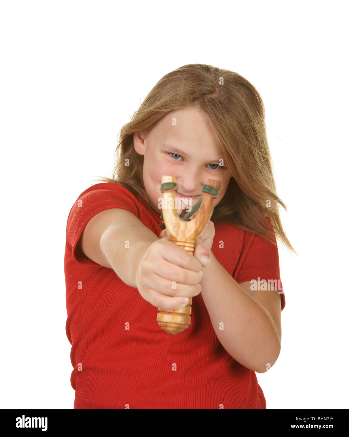 naughty little girl with a slingshot on white Stock Photo