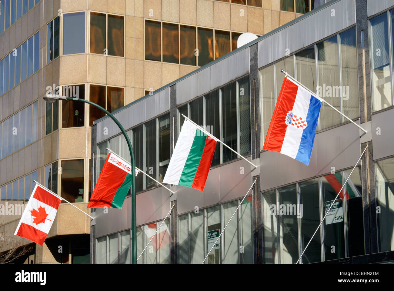 Flags from various nations outside a building during the 2010 Winter Games, Vancouver, British Columbia, Canada Stock Photo