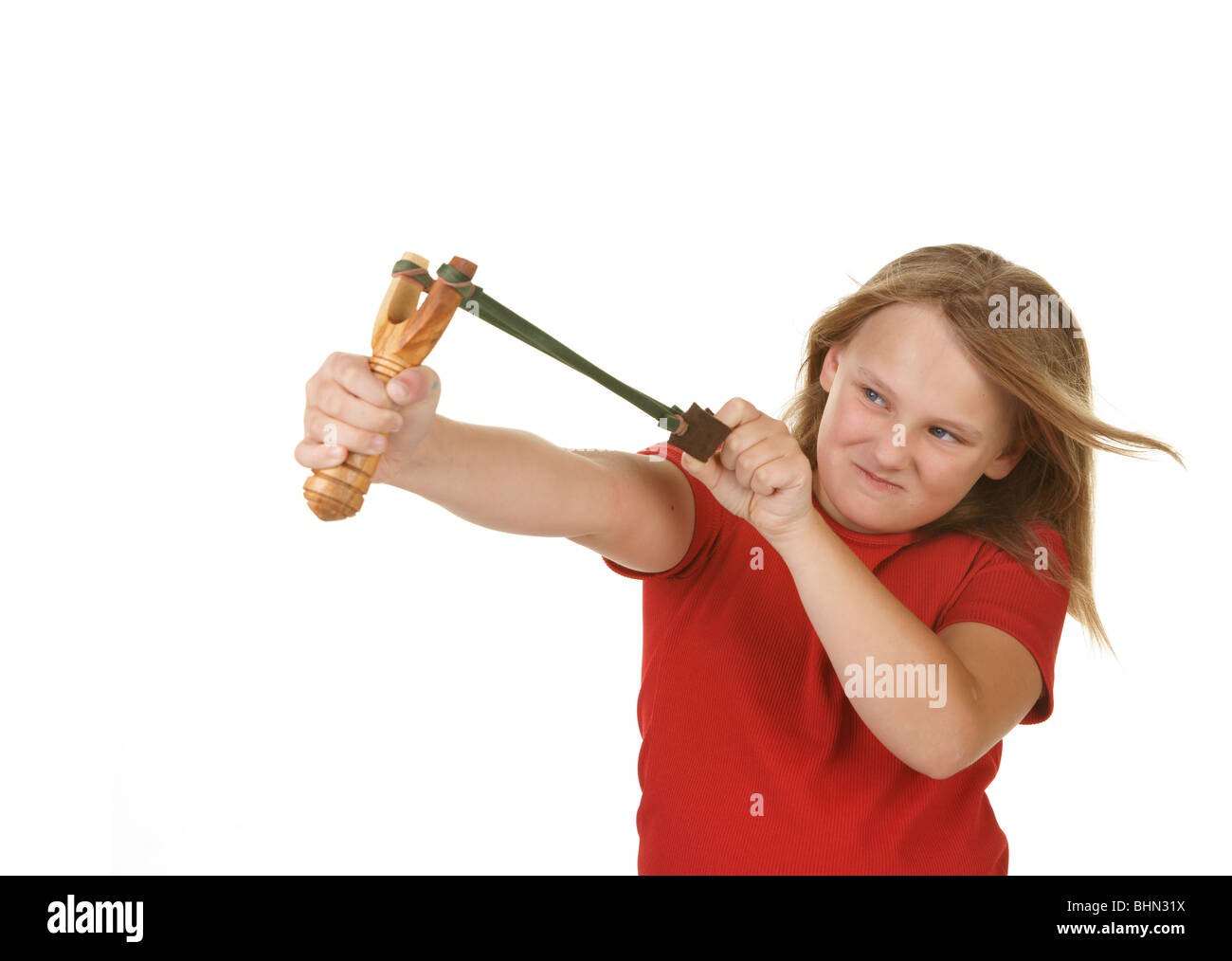 naughty little girl with a slingshot on white Stock Photo