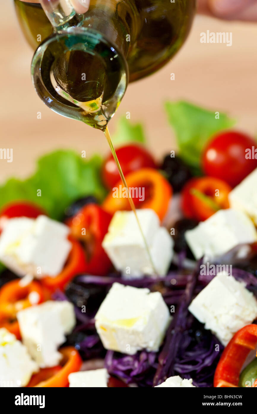 Close up macro photograph of olive oil dressing being poured onto a fresh salad Stock Photo Alamy