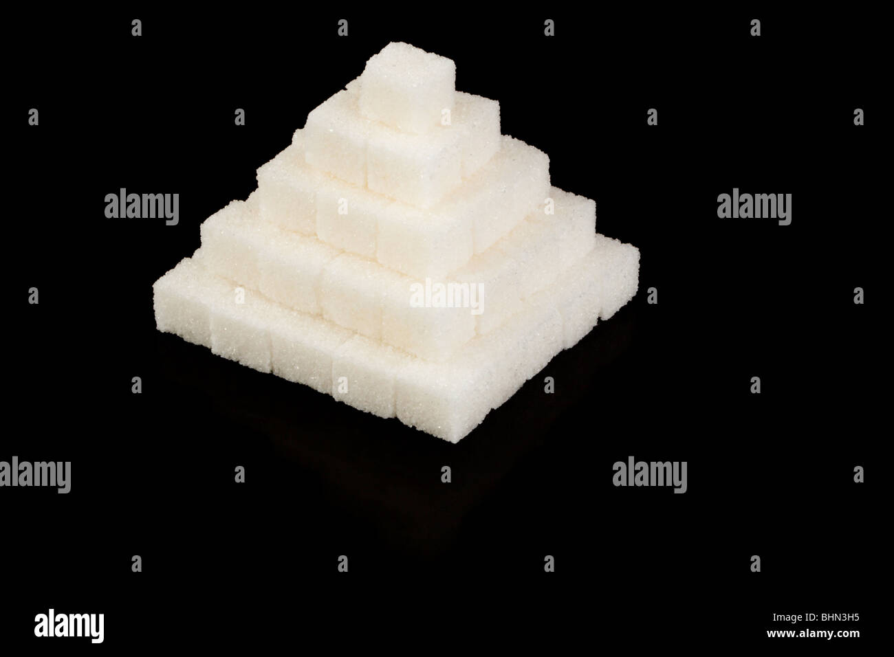 Pyramid from refined sugar on a black background Stock Photo