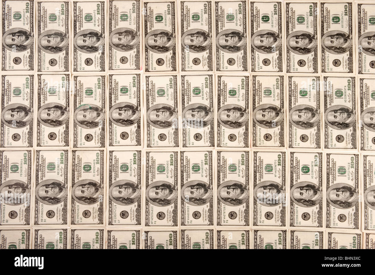 $100 US currency laid out in a row Stock Photo