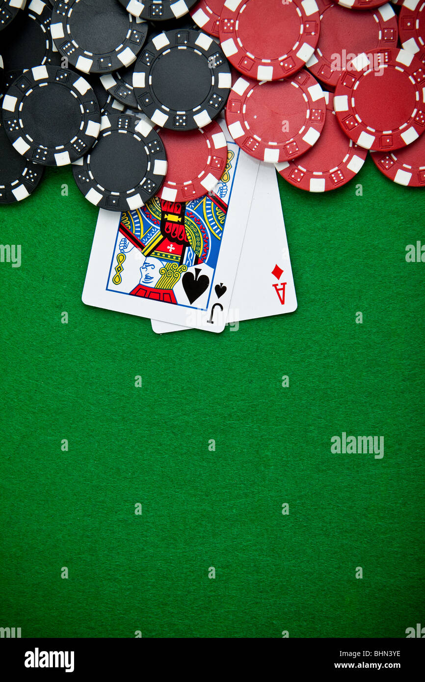 Black and red poker chips in the background Stock Photo - Alamy