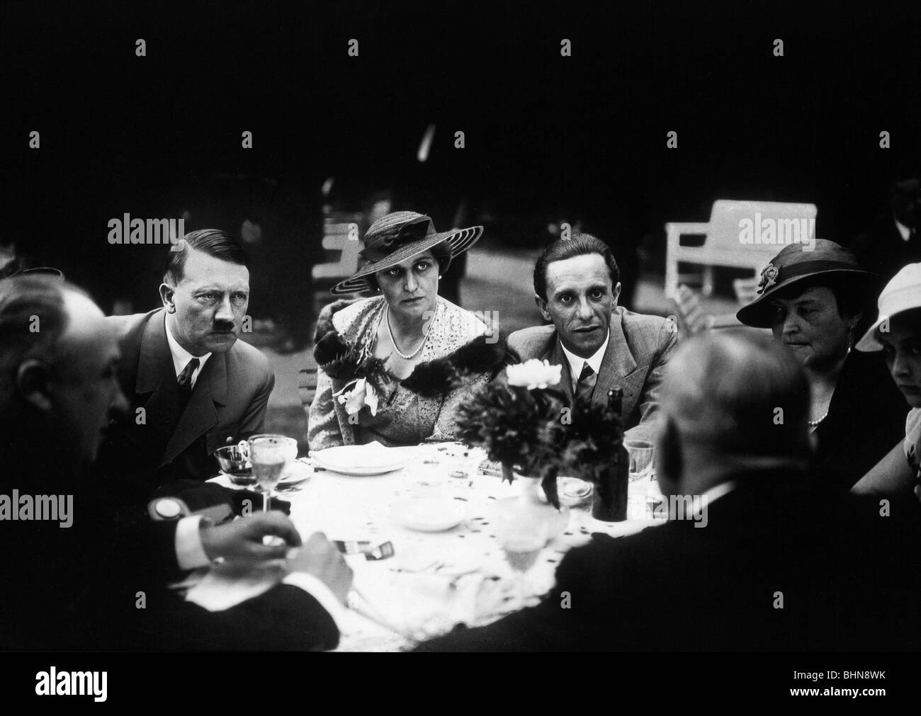 Hitler, Adolf, 20.4.1889 - 30.4.1945, German politician (NSDAP), Fuehrer and Reich Chancellor since 1933, scene, with Magda and Joseph Goebbels, Walter Funk and others, 1930s, Stock Photo