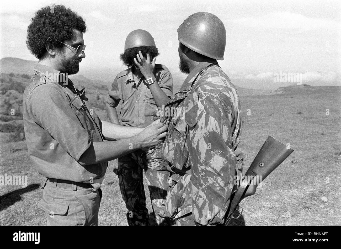 Jose Ramos-Horta fastens Fretilin commander's jacket while defending East Timor against Indonesian incursion in mountains Stock Photo