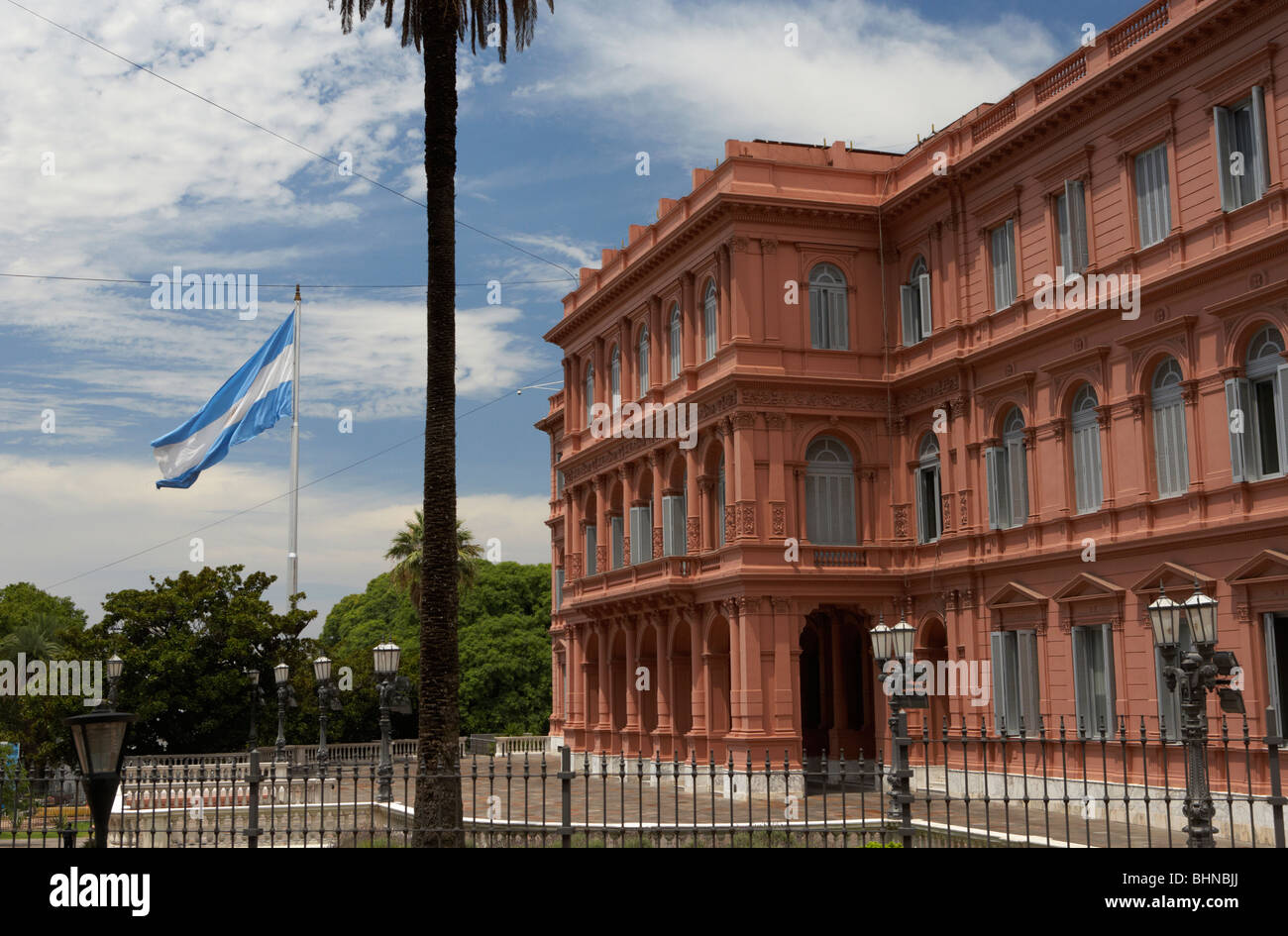 Large argentine flag flying above the north wing of the casa rosada the pink house presidential offices republic of argentina Stock Photo
