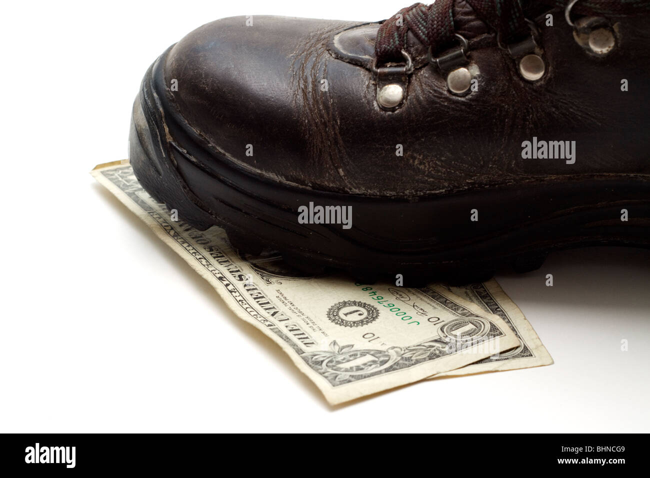 Dollars being stepped on Stock Photo