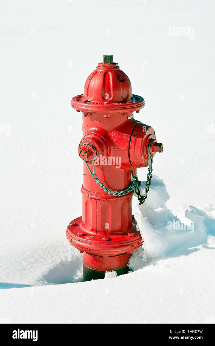 Red fire hydrant in snow. Stock Photo