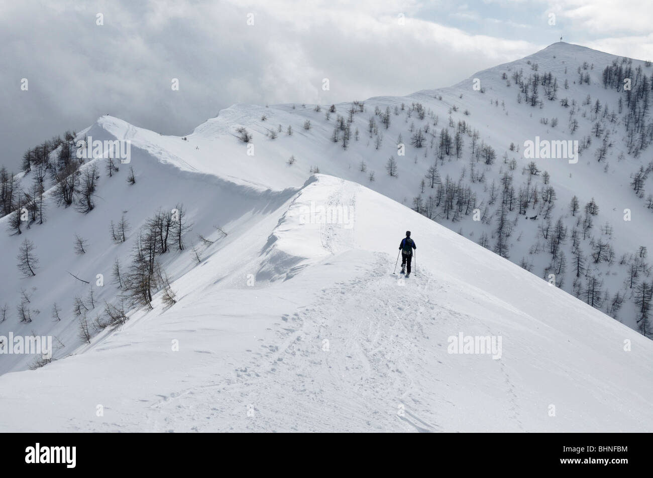 Snowshoeing on summit ridge of Mont Chajol near Casterino, Mercantour Alps, France Stock Photo