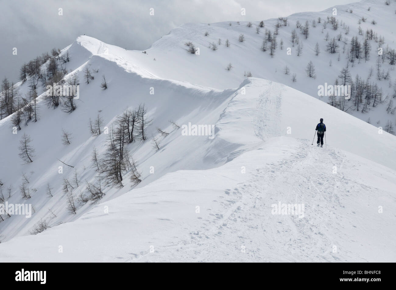 Snowshoeing on summit ridge of Mont Chajol near Casterino, Mercantour Alps, France Stock Photo