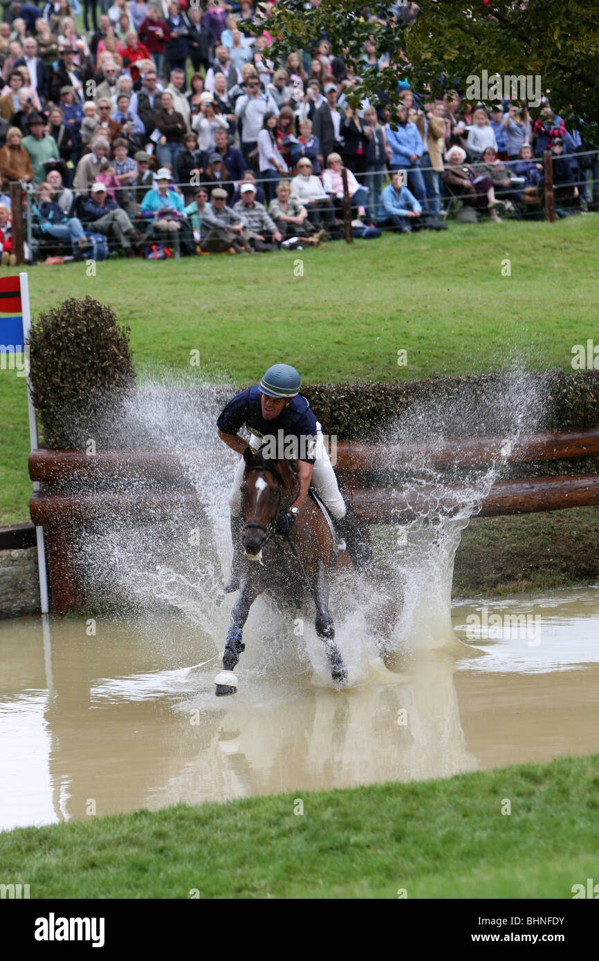 HORSE AND JOCKEY AT WATER JUMP ON THE CROSS COUNTRY COURSE AT BURGHLEY
