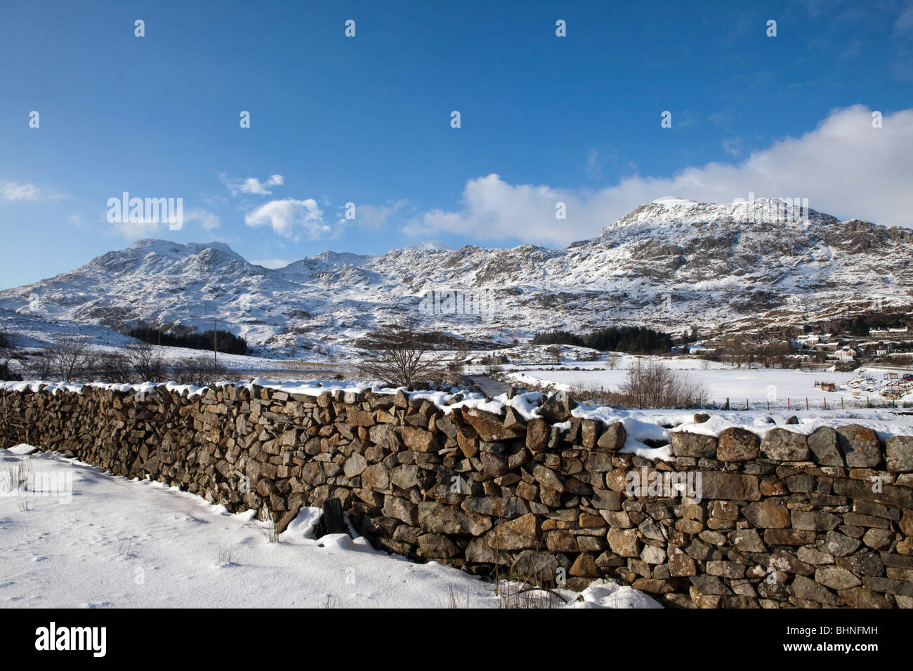 A traditional dry stone wall, with the Moelwyn Mountains in the background Stock Photo