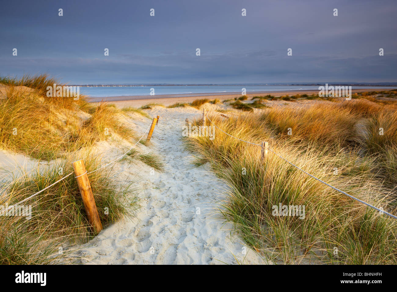 Sand dunes at East Head, West Wittering. Early sunshine breaking Stock