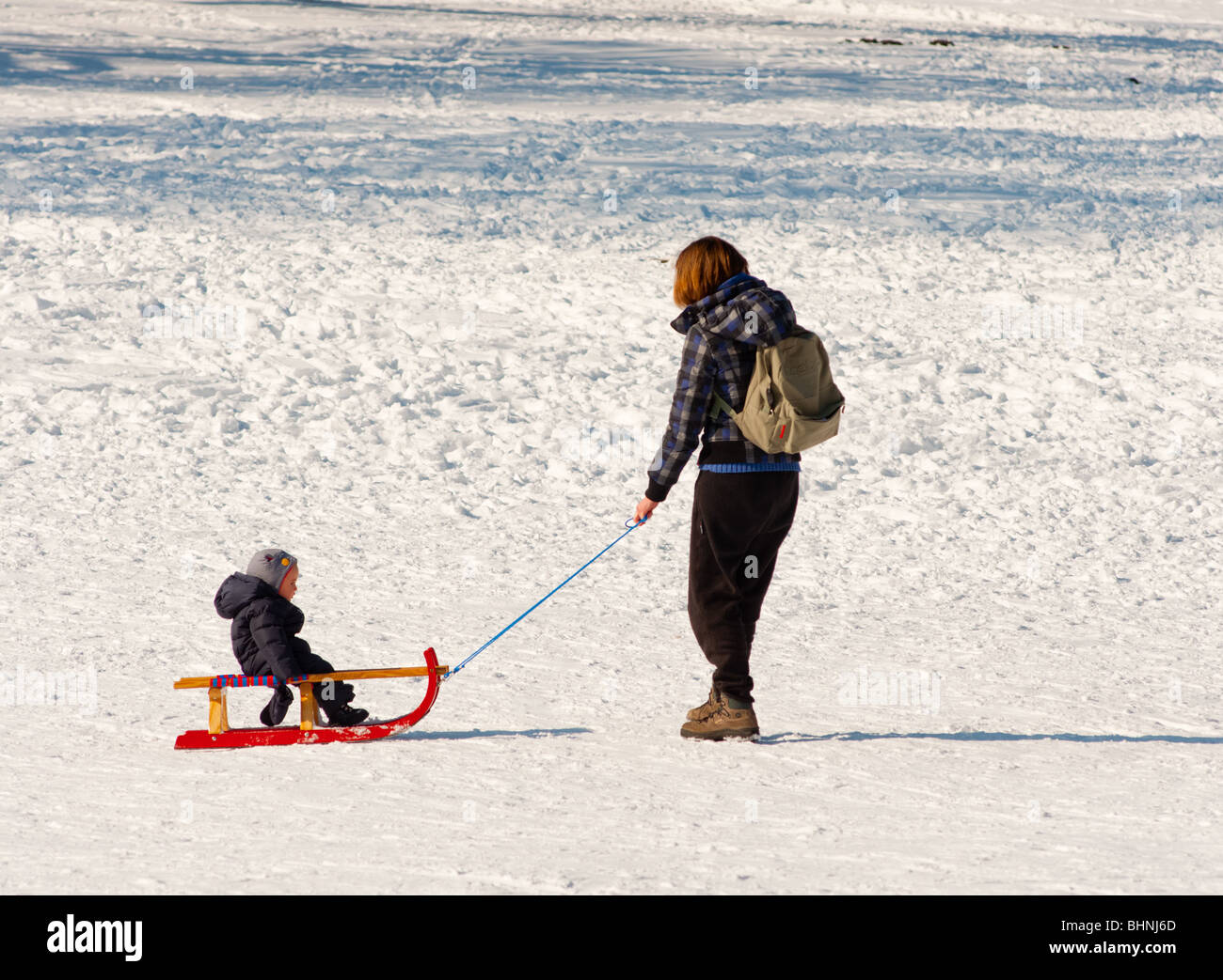 Mum and daughter sledging Stock Photo