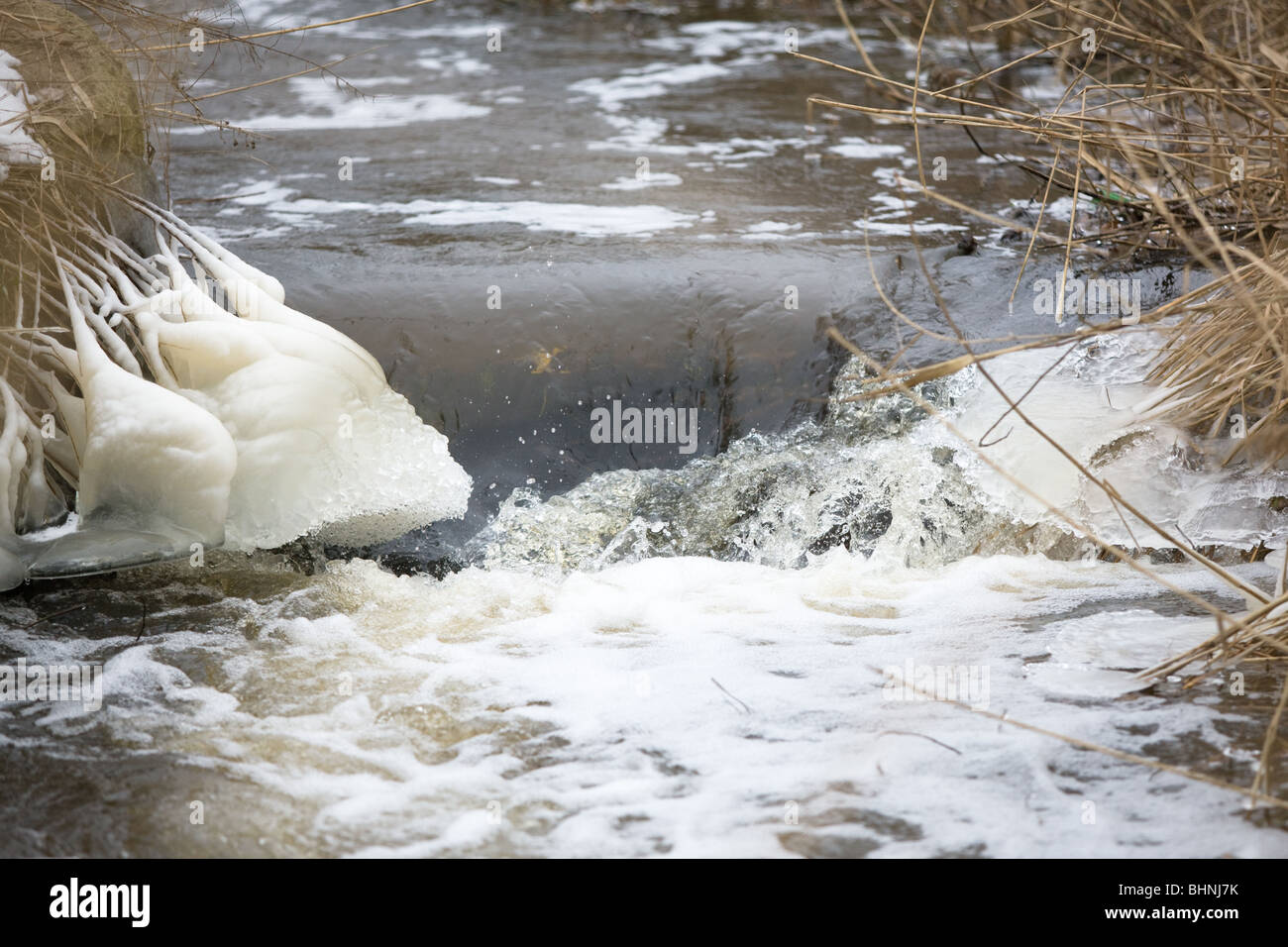 Ice scupltures on the banks of a small river Stock Photo