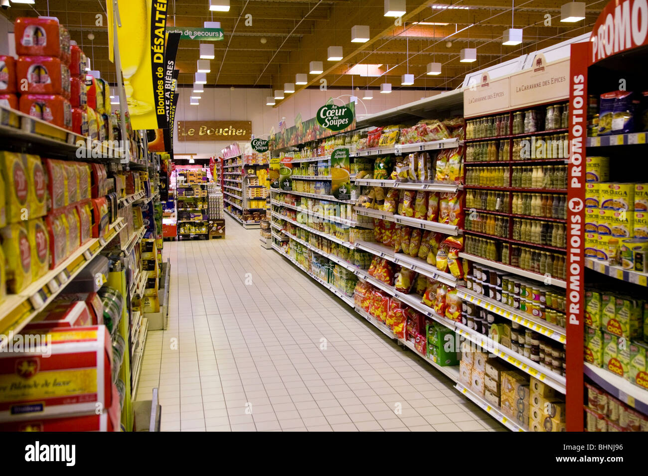 Looking down a supermarkets aisle in a French supermarket. France. Stock Photo