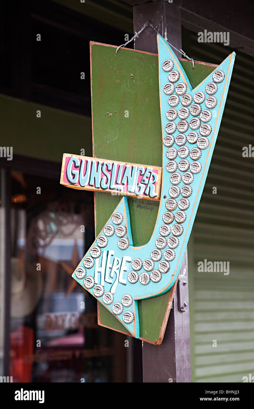 Sign for gunslinger bar using bottle caps Bandera Texas USA Stock Photo