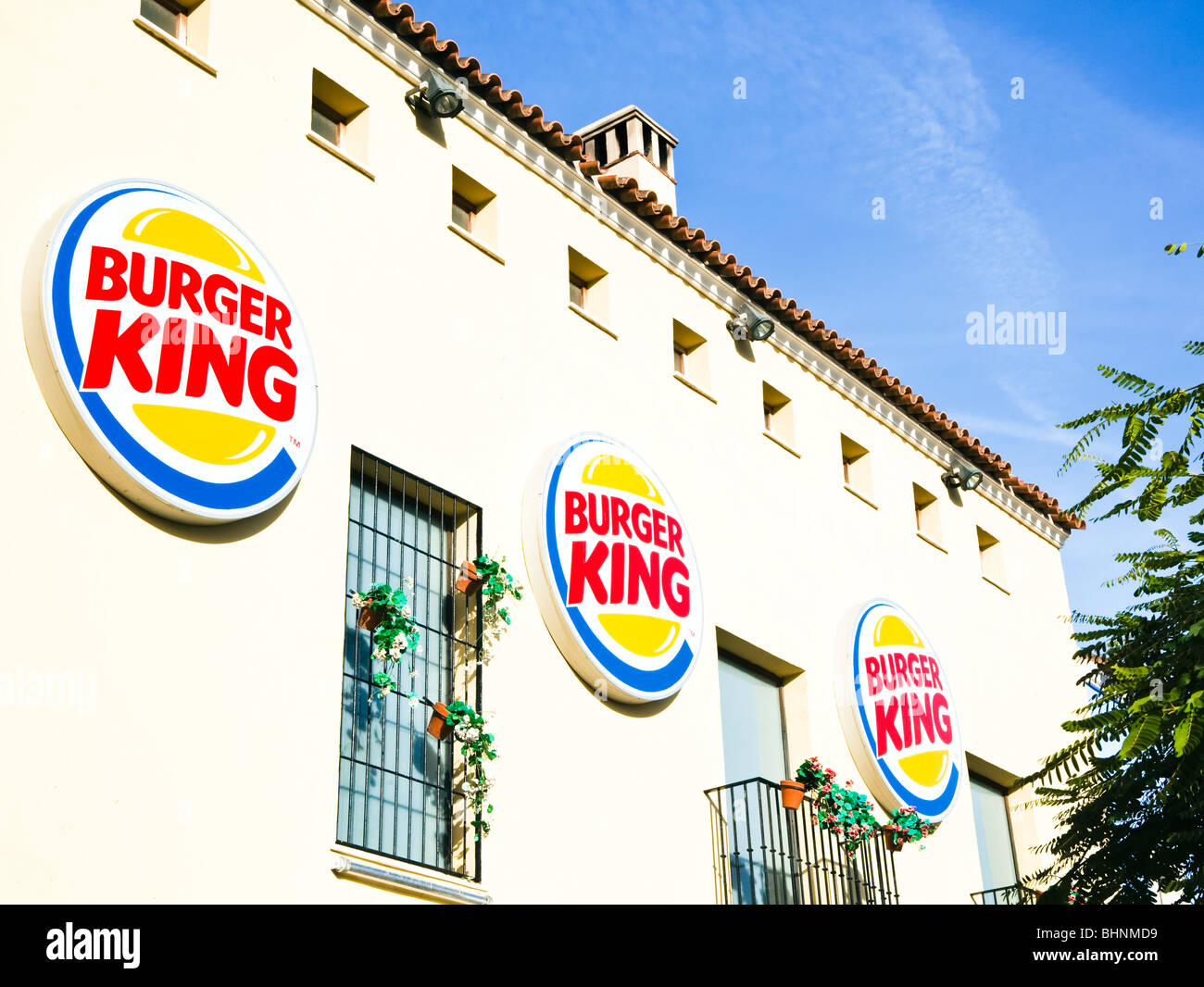 Burger King fast food restaurant and logos at Plaza Mayor shopping centre, Malaga,  Costa del Sol, Spain. Stock Photo