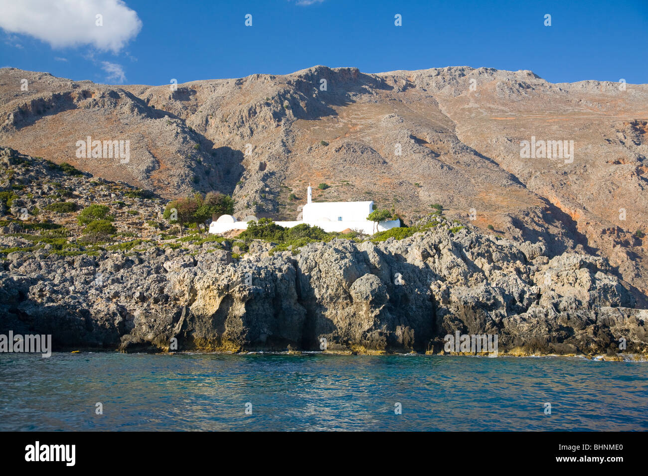 Traditional church beneath the White Mountains, Loutro, Sfakia region, Crete, Greece. Stock Photo