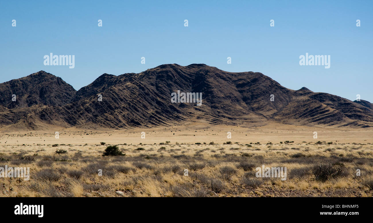 Black mountain showing folded strata. Geology. Namibia Stock Photo