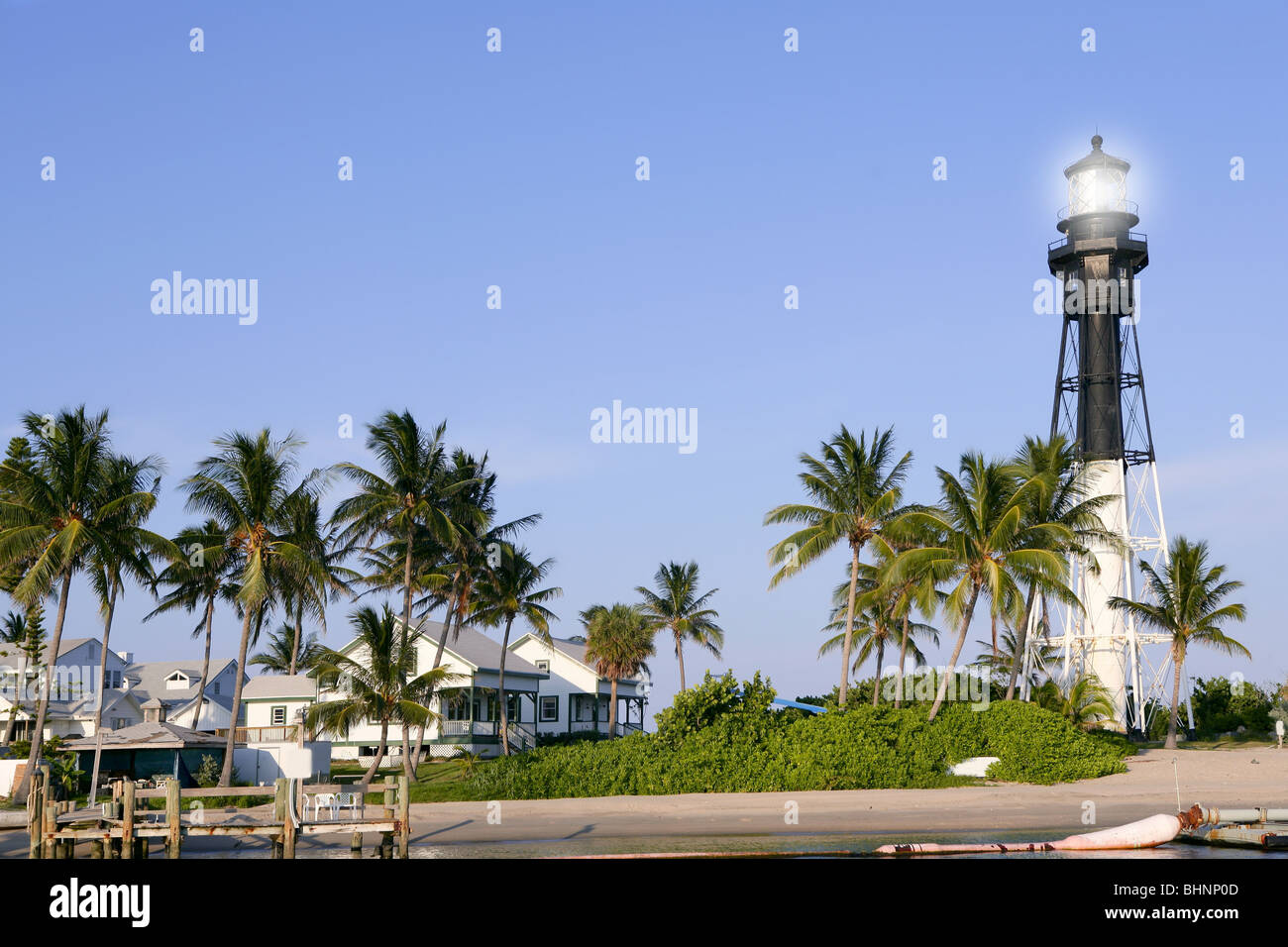 Florida Pompano Beach Lighthouse palm trees and blue sky Stock Photo