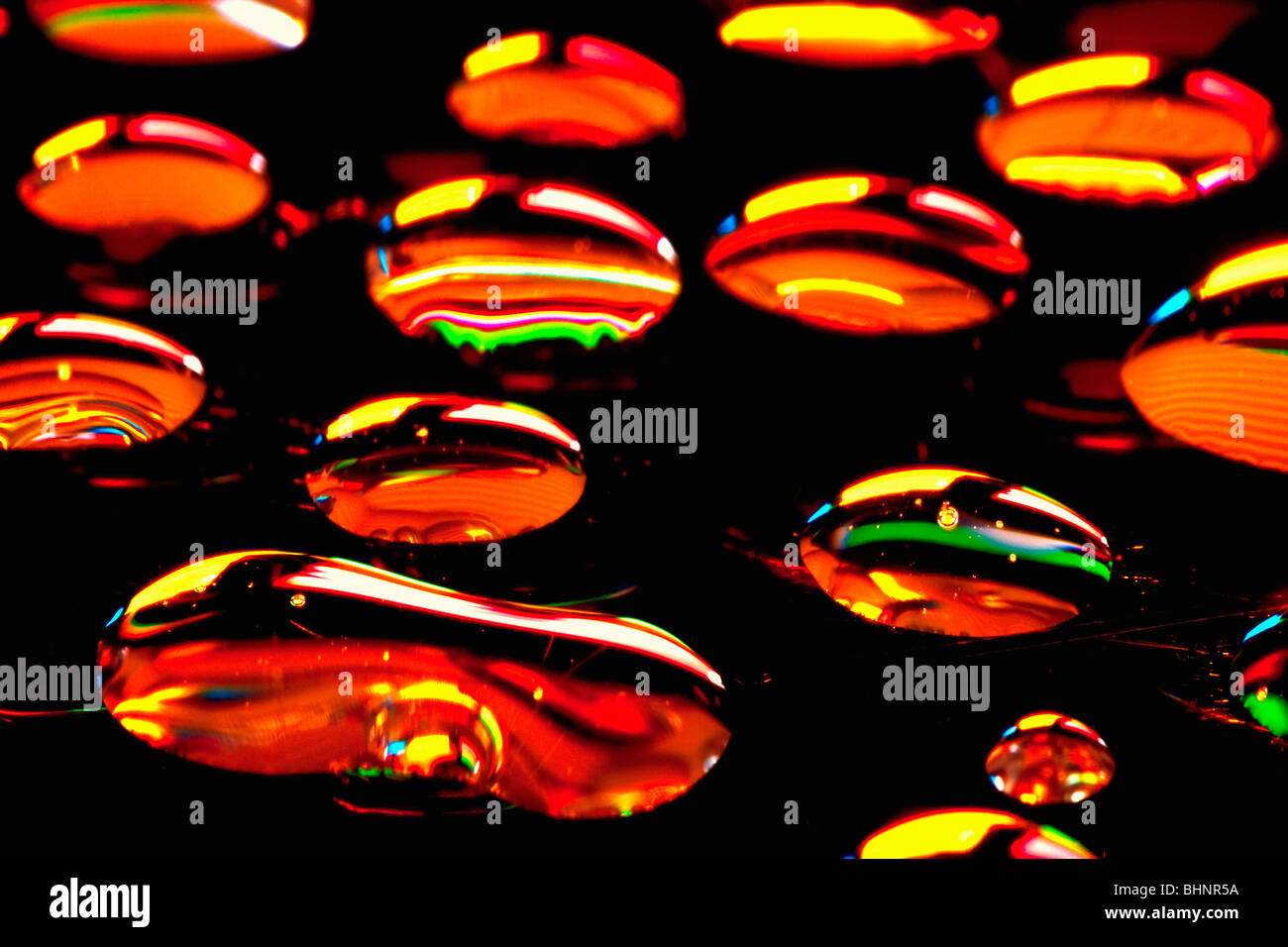 extreme closeup of waterdrops reflecting colors Stock Photo