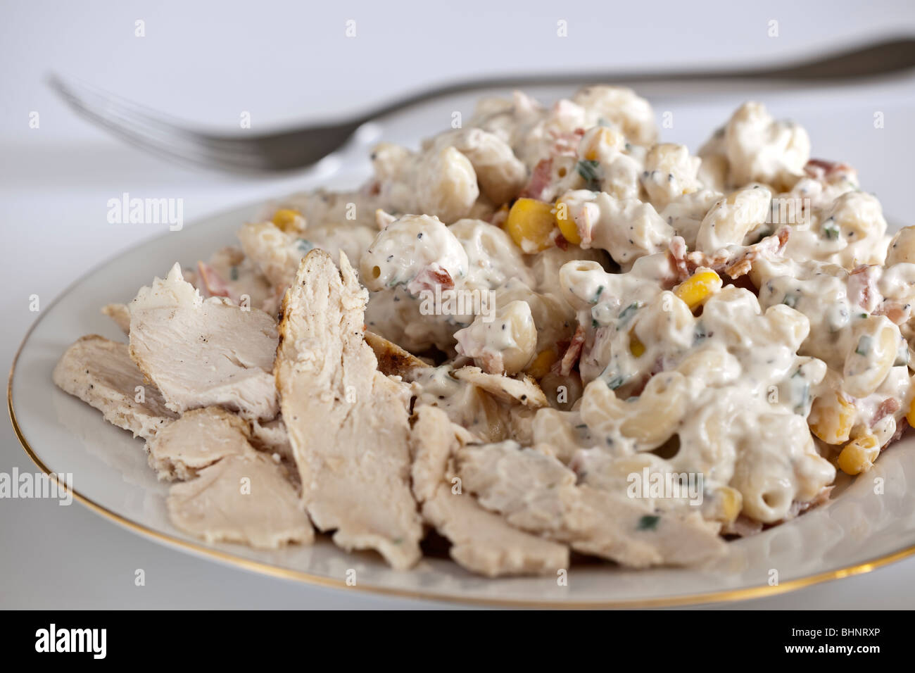 Chicken and bacon Pasta in a mayonnaise sauce on a white plate Stock Photo Alamy