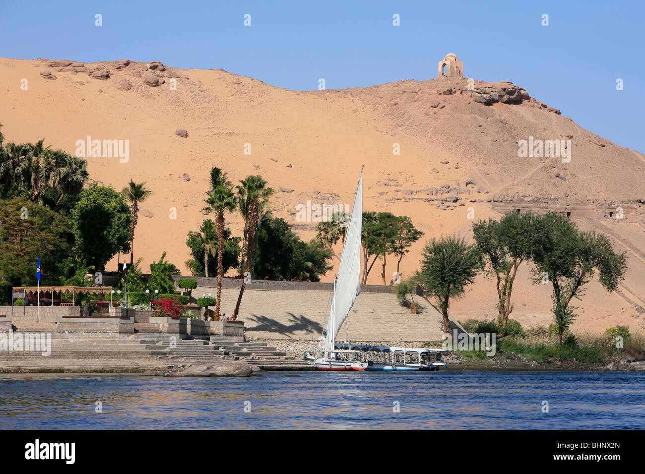 Felucca Moored At Kitchener s Island With The Tombs Of The Nobles As A Felucca Moored At Kitchener s Island With The Tombs Of The Nobles As A