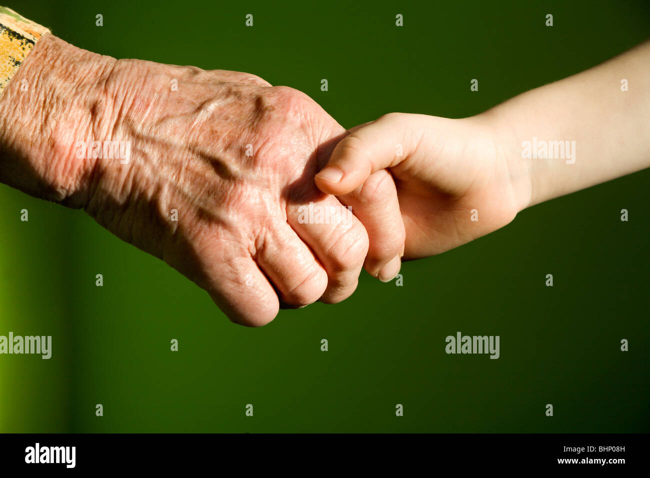 hands of old woman and the child Stock Photo