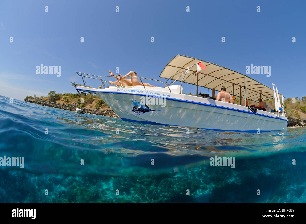 Split level picture of diving boat in tropical sea, Nationalpark Menjangan, Bali, Indonesia, Indo-Pacific Ocean Stock Photo