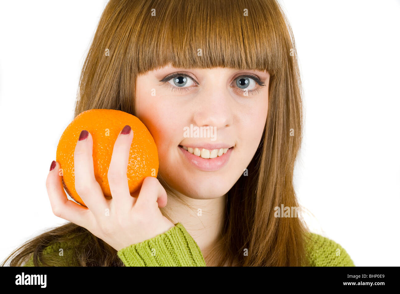 Beautiful girl holding an orange in her hand, isolated on white Stock ...