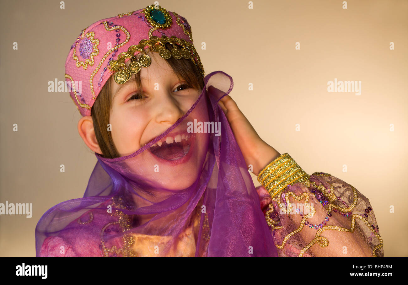 smile of little girl in the carnival clothes Stock Photo - Alamy
