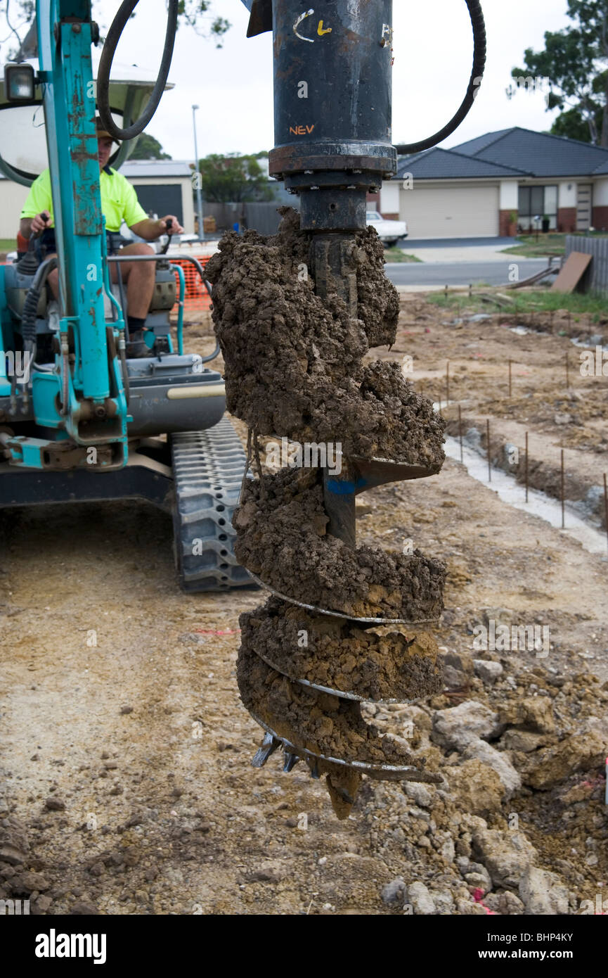 drilling foundation holes for a house slab Stock Photo Alamy