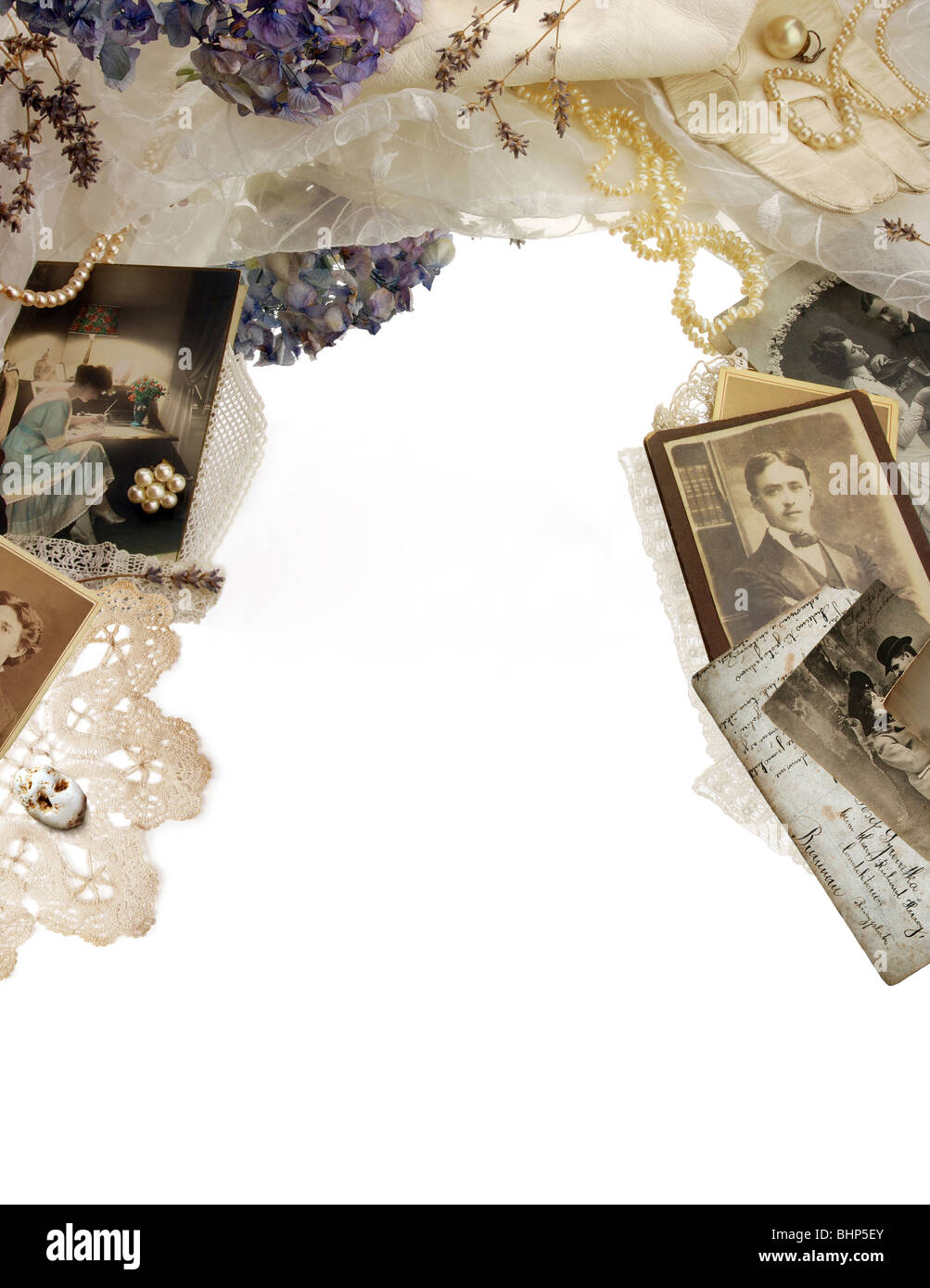 Vintage bordering with photographs, dried flowers and pearls Stock Photo