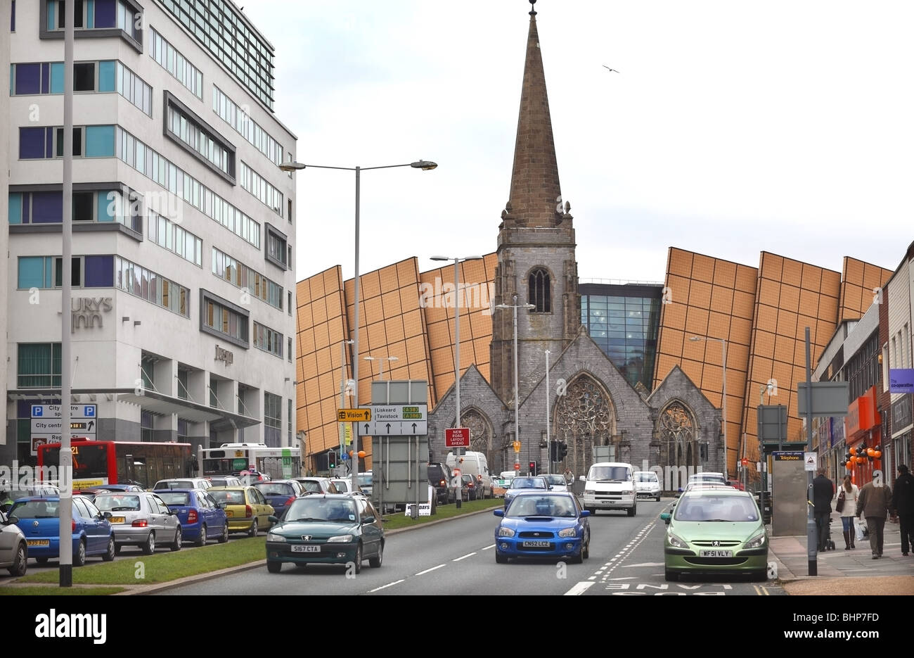 Plymouth's Exeter Street with Charles Church and shopping centre behind. Stock Photo