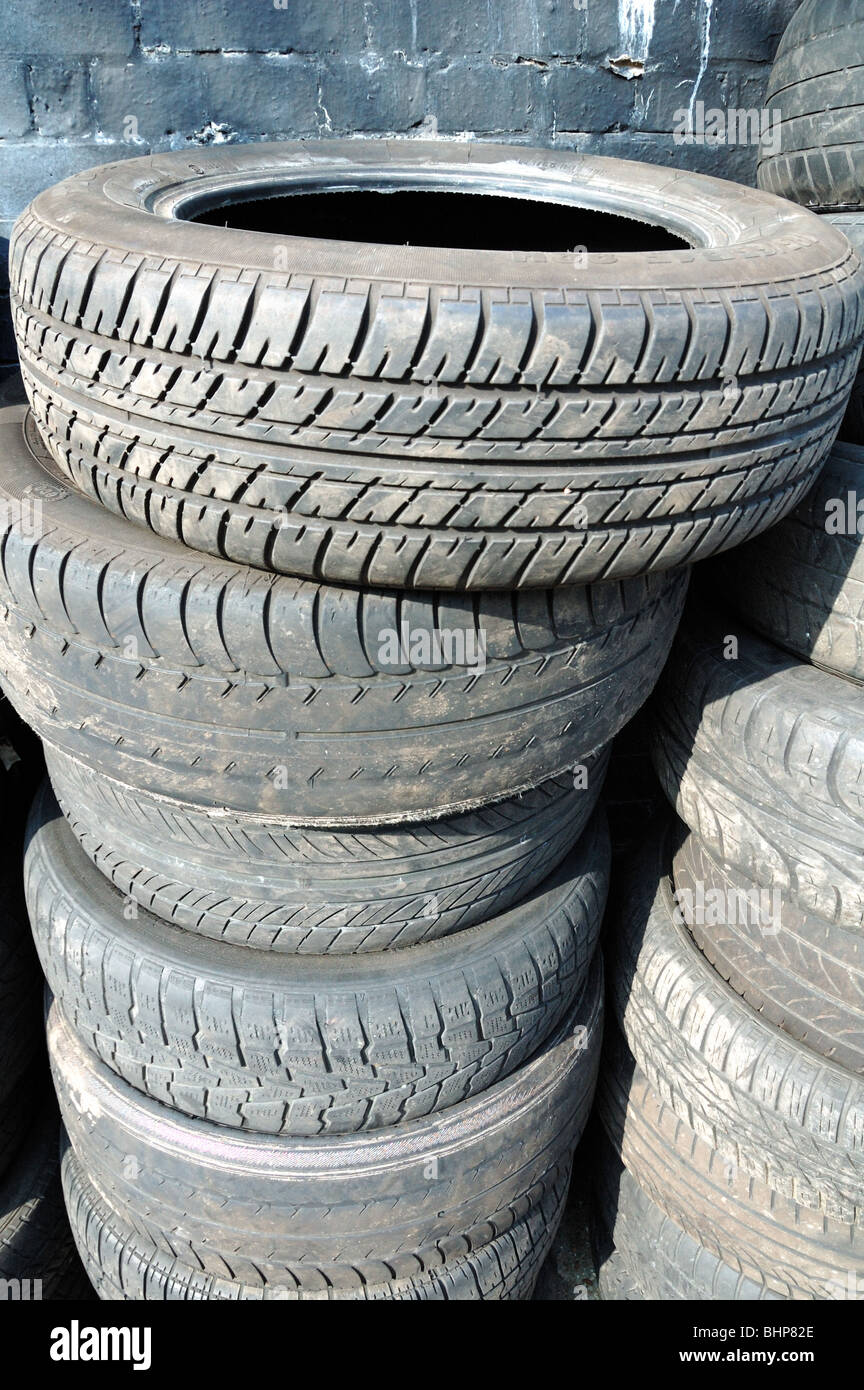 Pile of tyres dumped in street Stock Photo