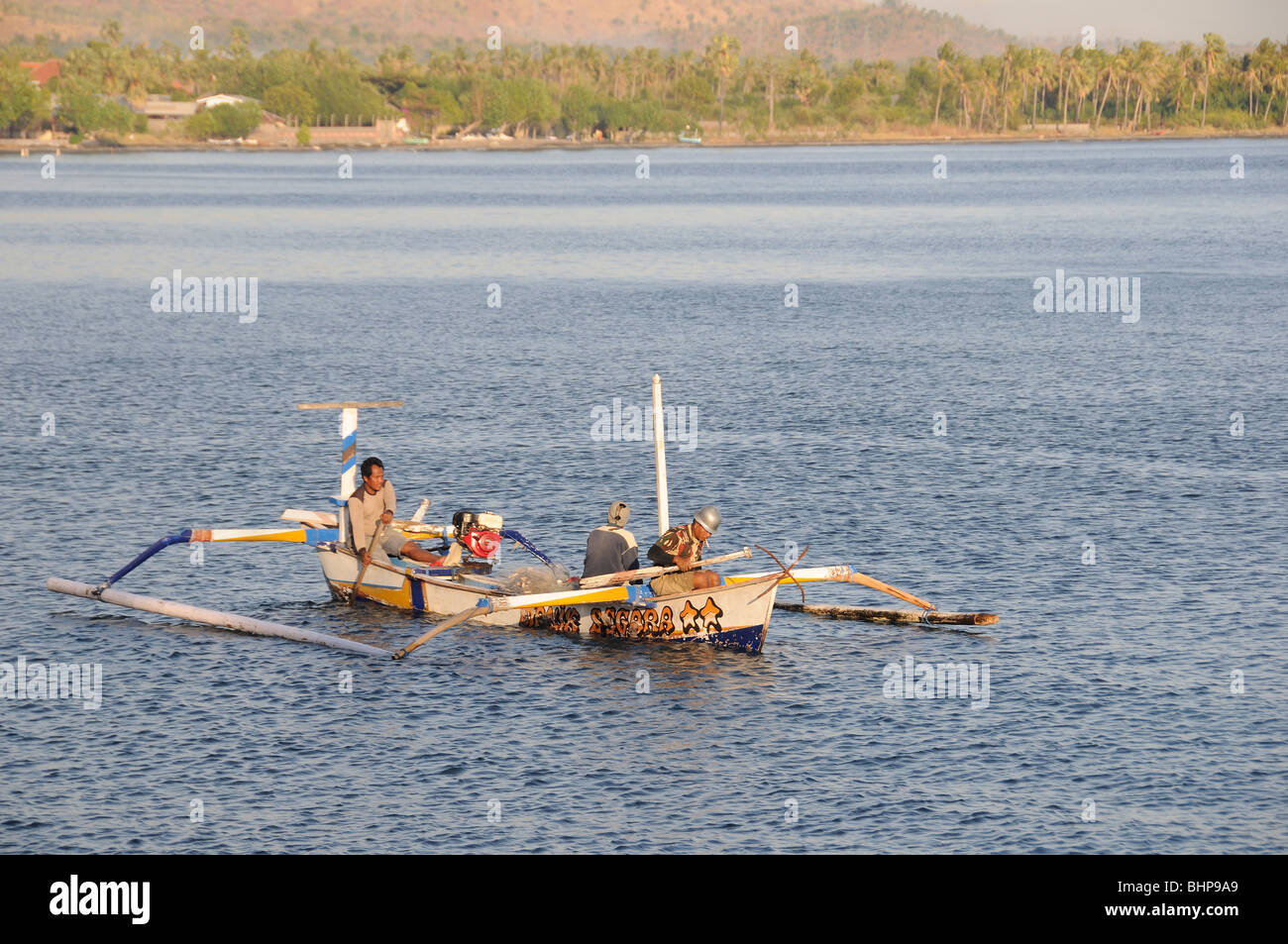 Outrigger-Canoe with fisherman, Pemuteran, Bali, Indonesia, Indo-Pacific Ocean Stock Photo